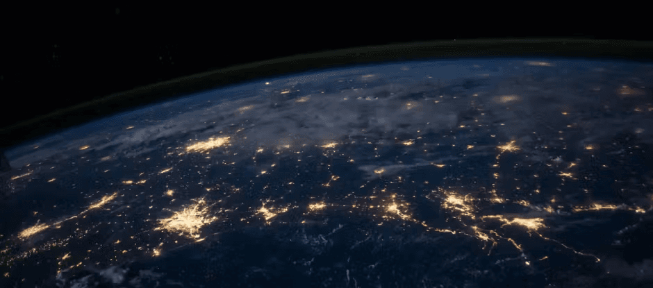 Earth at night from space showing city lights across continents