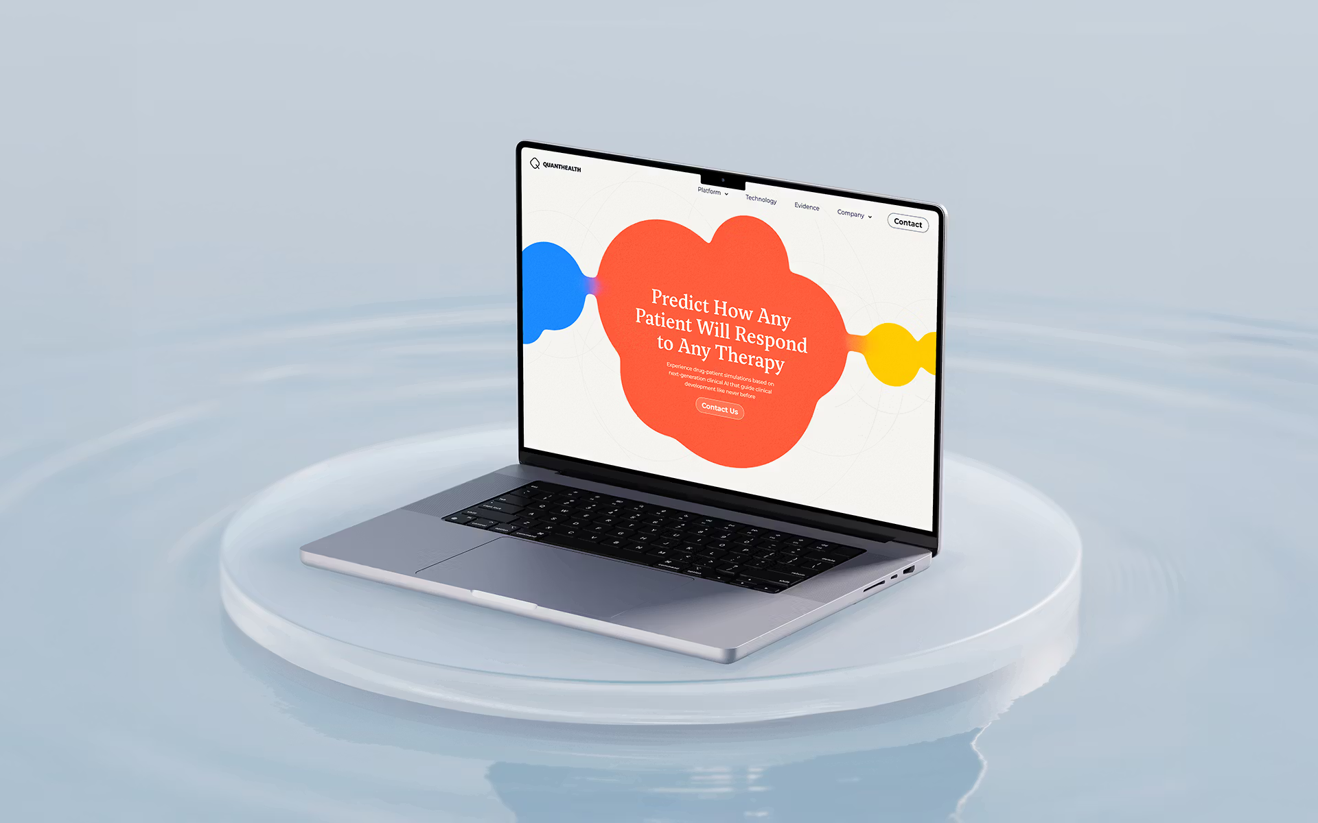 Laptop on reflective surface showing colorful website landing page